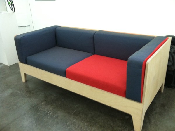 The laminate frame holds the cushions in place; upholstery fits cushions closely. 